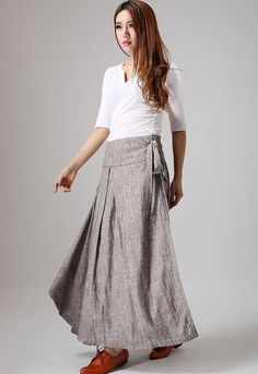 "The Wrap skirt tie by the side string. another side inner open by three buttons. The linen skirt has two side pockets. The wrap linen skirt has a Irregular hem, two different side. DETAIL * The fabric is a medium-weight sturdy linen-cotton blend. it is Environmentally friendly, breathable, comfortable, good drape, comfortable to wear, etc. * Lovely full, length wrap around skirt, the length is fun for flipflops and heels. * wrap-around fastens on side at hip with three buttons inside, then is t Ageless Style Aging Gracefully, Long Wool Skirt, Dark Grey Skirt, Linen Wrap Skirt, Maxi Wrap Skirt, Long Wrap Skirt, Skirt Linen, Full Length Skirt, Tailored Clothes