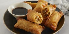 some fried food on a plate with dipping sauce