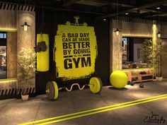 there is a gym room with yellow and black decorations