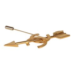 This 93P Chanel Brooch features a 24K gold plated CC with an arrow. Origin: FranceCondition: Vintage; Excellent - This brooch shows scratching throughout.Accompanied by: Chanel box and pouchMeasurements: 3" Length from arrow point to arrow back; 1"- Center top of CC to bottom Gucci Bow Brooch, Luxury Gold Vintage Pins, Ysl Brooches, Vintage Gold Crescent Brooch, Vintage Gold Brooch With Bow, Chanel Brooch, Chanel Box, Neverfull Mm Monogram, Louis Vuitton Damier Azur