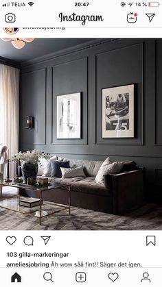 a living room filled with furniture and pictures on the wall above it's coffee table