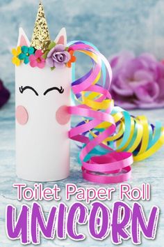 the toilet paper roll unicorn is next to some streamers