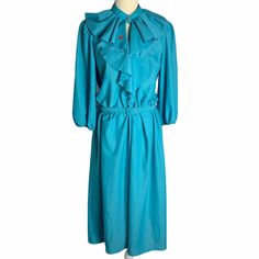 "Vintage Key Hole Ruffle Midi Dress M Blue 3/4 Balloon Sleeve Belt Union Made Brand: Kay Windsor Made in USA Measurements: Chest: 19.5\" underarm to underarm Sleeve length: 18\" Length: 46\" from shoulder to hem Pre-owned No size or fabric tags. Tiny stain on the ruffle of the collar." Blue 3/4 Sleeve Dress With Ruffles, Hawaiian Halter Dress, Plaid Jumper, 4 Balloon, Fashion 70s, Lace Evening Gowns, Floral Babydoll Dress, Pink Peacock, Dirndl Dress