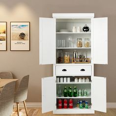 an open cabinet with drinks on it in a dining room