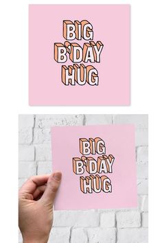 someone holding up a pink card with the words big bday hug on it in different colors