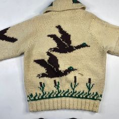 an old sweater with birds on it