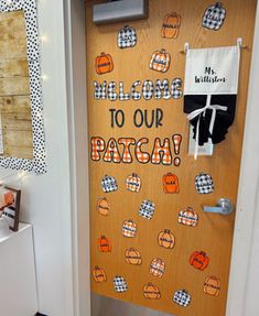 a door decorated with an orange and black welcome sign