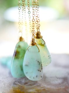 This stunning necklace is handmade with gorgeous specimens of natural Chrysoprase. This gem, also known as green Chalcedony, is said to promote joy and happiness, as well as attract love and prosperity. No two pendants are the same. Some are minty green, while others have flecks of brown, white, or black within them. The chains are sterling silver or 14k gold filled. So go ahead, flaunt your unique style! GEMSTONE: Chrysoprase STONE SIZE: 20 to 32mm (.78 to 1.25") STONE SHAPE: Irregular Smooth P Nature-inspired Chrysoprase Necklaces, Nature-inspired Chrysoprase Necklaces As Gift, Nature-inspired Chrysoprase Necklace As Gift, Handmade Chrysoprase Necklaces In Nature Style, Handmade Green Chrysoprase Necklaces, Handmade Green Emerald Chrysoprase Necklace, Spiritual Chrysoprase Gemstone Necklaces, Green Chrysoprase Necklace For Healing, Spiritual Chrysoprase Gemstone Necklace