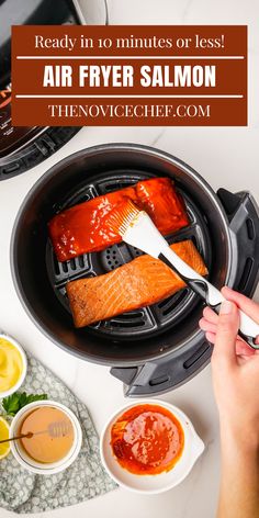 salmon being cooked in an air fryer with sauce