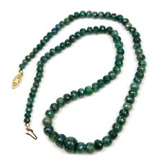 Faceted Emerald Graduated Knotted Necklace with Gold Box Pearl Clasp Approx. 22" Long Bead Size approx. 3x5mm to 9x12mm Strung on Silk Bead Cord Handcrafted at Beads of Paradise NYC Emerald is the Modern and Traditional birthstone for May. Emerald is the only stone besides Topaz that is listed in all of the ancient birthstone tables. Emerald is the most precious stone in the Beryl group. The name Emerald comes from the Greek "smaragdos" via the Old French "esmeralde", and really just means 'gree Formal Emerald Necklace With Round Gemstone Beads, Emerald Necklace With Polished Beads As A Gift, Formal Emerald Necklace With Faceted Round Beads, Gift Emerald Necklace With Polished Rondelle Beads, Gift Polished Round Emerald Bead Necklace, Gift Polished Beads Emerald Necklace, Gift-ready Polished Emerald Rondelle Necklace, Faceted Round Emerald Bead Necklace, Luxury Polished Emerald Bead Necklaces