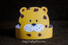 a paper crown with a bear on it