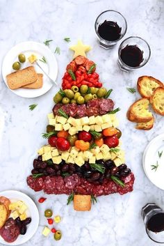 a christmas tree made out of cheese and olives