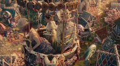 an aerial view of a carnival with lots of colorful items and people in it, including clowns