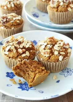 three muffins on a plate with one cut in half