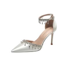 a pair of white high heeled shoes with crystal embellishments