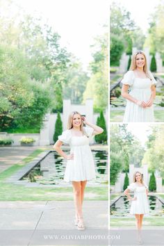 a beautiful young woman posing in front of a pond with her hands on her hips