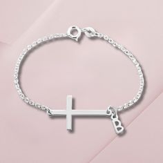 Personalized Cross Bracelet Dainty Bracelet Silver Cross Bracelet Silver Jewelry Christian Bracelet Initial Bracelet Religious Jewelry Material: Sterling Silver, 24k Gold Plating, Rose Gold Plating Thickness: 0.7mm / 0.03″ Chain Style: Rolo Chain Pendant Size: 25mm x 14mm / 1.0" x 0.6" 5.5" Chain (14cm) - Avg. child's wrist 6.5" Chain (16.5cm) - Avg. woman's wrist 7.5" Chain (19cm) - Avg. woman larger wrist All items purchased will be shipped within 1-5 business days with a tracking code. USA - Elegant Cross Metal Bracelets, Metal Cross Bracelets, Elegant Metal Cross Bracelet, Adjustable Cross Chain Bracelet As Gift, Elegant Cross-shaped Metal Bracelet, Elegant Silver Cross Beaded Bracelets, Elegant Silver Beaded Cross Bracelets, Elegant Personalized Cross Bracelets, Silver Cross Chain Bracelet As Gift