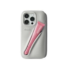 an iphone case with a pink toothbrush in it and the phone holder attached to it