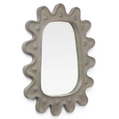 a mirror that is shaped to look like an animal's tail, on a white background