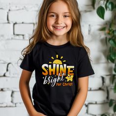 Christian Kids T-shirt with cute Jesus design, perfect for youth. This vibrant short sleeve tee features a 'Shine for Christ' quote, giving off a positive and faith-based vibe. Ideal for kids who want to express their religious beliefs stylishly. Relevant for holidays like Easter, Christmas, and Sunday School events. Product features - Side seams for added structural support - Ribbed knit collar for shape retention - Shoulder tape for stability - Made with extra lightweight, soft cotton - Retail Christian Kids Shirts, Jesus Kids, Christian Youth, Christ Shirts, Faith Quote, Jesus Design, Jesus Tees, Christian Kids, Youth Shirt