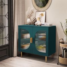 a blue cabinet with two glass doors in front of a mirror and vases on the floor