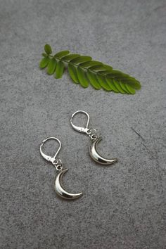 Silver plated lever back earrings with silver crescent moon charms dangling. Size of moon: 2cm x 2cm Free worldwide shipping Multiple orders receive a free gift <3 Packaging - Eco friendly and gift ready Each item is packaged keeping in mind an eco friendly policy. Jewelry is presented in a reusable organza bag in a recyclable/reusable gift box. Mystical Moon Charm Dangle Earrings, Mystical Nickel-free Crescent Earrings, Mystical Sterling Silver Moon Charm Earrings, Dainty Silver Earrings With Moon Charm, Moon Earrings Silver, Boho Witch, Half Moon Earrings, Back Jewelry, Celestial Jewelry