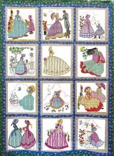 a quilt with many different pictures of people in dresses and flowers on the front, one is