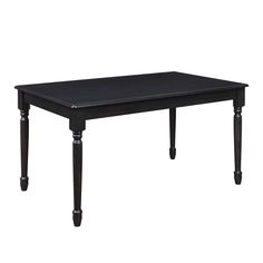 a black table sitting on top of a white floor