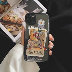 a person holding up a phone case with an advertisement on it