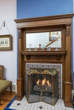 a fireplace with a mirror above it in a living room