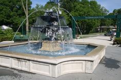 a fountain with water spouting from it's sides