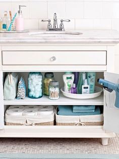 a bathroom cabinet with various items in it