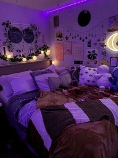 a bed room with a neatly made bed and purple lights