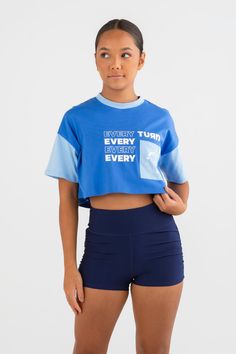 Active meets street style in your new essential Tee—the Elle Cropped Overise T-Shirt in Blueberry Blue. It’s got a cropped oversized fit that’s a wardrobe must-have, paired with athletic color blocking and an Every Turn screen print graphic. Made to be worn all day long. Blue Relaxed Fit Cropped T-shirt For Streetwear, Sporty Crew Neck Cropped Shirt For Streetwear, Sporty Crew Neck Cropped Shirt, Trendy Oversized Sports Tops, Oversized Color Block Athleisure Top, Sporty Crew Neck Crop Top, Sporty Crew Neck Crop Top For Streetwear, Athleisure Color Block Cotton Top, Sporty Short Sleeve Crop Top For Streetwear