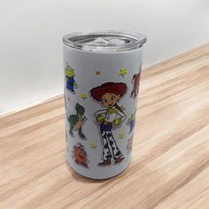 this is an image of a tumbler with cartoon characters on it