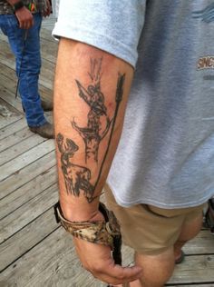 a man with a tattoo on his arm