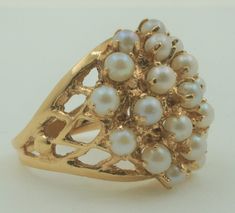 Beautiful vintage 1970s handmade 14K solid yellow gold statement ring with genuine pearls. Pearl is the June birthstone, this ring would make a wonderful birthday gift for someone you love.   Band width 2.7 mm at the bottom of the ring and approximately 20mm at the top of the ring.  Ring size: 6 (sizeable upon request) Pearls measure approx.: 3.65mm x 3.65mm Ring weight approx.: 8.1 g Hallmark: 14K Will be placed into a suitable gift box Free shipping within the U.S. Larchmont Ny, Georgian Jewelry, Pearl Fashion, Gold Statement Ring, June Birthstone, Real Pearls, Dainty Bracelets, Fashion Ring, June Birth Stone