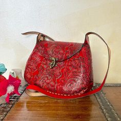 "MADE IN MEXICO By: Mexican Artisans For: Women Color: red Dimensions: 9.5 x 8 x 2.5 Details: - 100% Authentic Leather - Style: Crossbody | Shoulder Bag - Embossed Design - Hook lock closure - Adjustable & Non-Removable Strap: 22\" Drop Contact us for more details PLEASE READ BEFORE PURCHASE: The picture is an ACCURATE REPRESENTATION. Colors in the pictures may vary a little by effects of light. Each product is handmade from Mexico causing differentiation and minor imperfections in each piece making them that much more unique. We strive to have consistency within our business but please be aware not all pieces are 100% alike. Please Read our Return Policy to learn more about returning or exchanging purchased items" Red Rectangular Flap Bag With Mobile Phone Holder, Red Rectangular Flap Bag For Mobile Phone, Red Flap Bag For Daily Use, Red Flap Bag With Mobile Phone Bag For Travel, Red Flap Bag With Mobile Phone Pocket For Travel, Red Flap Bag With Mobile Phone Holder For Travel, Red Handheld Shoulder Bag For Daily Use, Red Satchel Flap Bag With Mobile Phone Holder, Red Satchel Shoulder Bag With Mobile Phone Pocket