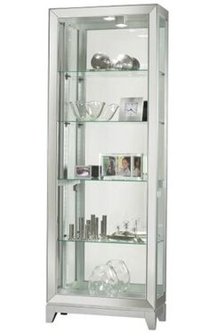 an empty glass display case with many items in the bottom shelf and shelves below it