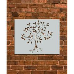 a painting on a brick wall depicting a tree with leaves and roots in the shape of a heart