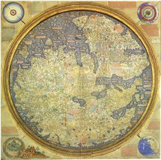 an old world map on display in a gold frame with blue and yellow designs around it