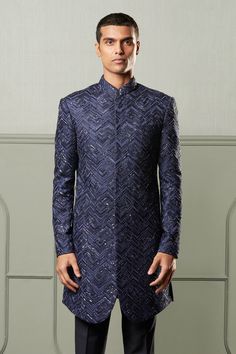 Navy blue sherwani with all-over intricate embroidery in chevron pattern, concealed placket and full sleeves. Comes with trousers.
Component: 2
Embroidered
Neckline: Band Collar
Sleeve Length: Full
Fabric: Sherwani: Silk; Trousers: Suiting
Color: Blue
Concealed placket
Straight fit pant - Aza Fashions Navy Blue Sherwani, Blue Sherwani, Shantanu And Nikhil, Embroidered Sherwani, Straight Fit Pants, Nehru Jackets, Silk Trousers, Embroidered Neckline, Intricate Embroidery