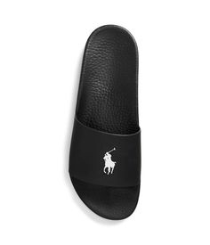 Slip into the ultra comfortable style of Polo Ralph Lauren® Polo Slide for everyday wear..Synthetic upper, lining, and insole..Round-toe silhouette..Broad band on the vamp..Slip-on style..Synthetic outsole..Imported..Product measurements were taken using size 9, width D - Medium. Please note that measurements may vary by size..Measurements: Weight: 6 oz Comfortable Synthetic Slides With Round Toe, Black Open Toe Slip-ons, Synthetic Slippers With Cushioned Footbed And Flat Heel, Casual Slip-on Slides With Ortholite Insole, Classic Summer Slip-ons With Cushioned Footbed, Casual Synthetic Slippers With Rubber Sole, Casual Synthetic Slide Slip-ons, Black Cushioned Slip-ons For Summer, Classic Slip-on Synthetic Slides