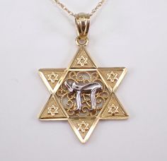 Vintage Star of David and Chai Pendant Necklace Charm with Chain. This pendant is 14KT Yellow Gold with the Chai being 14k White Gold, comes with an 18" 10K Yellow Gold chain. This necklace weighs 1.8 grams and the star measures 20 X 17.5 mm.  I will ship this pendant promptly in a beautiful gift box. ADDITIONAL REQUESTS If you would like to see more pictures of this item, please let us know and we would be happy to provide them for you. Please contact us with all questions, we are here to help. Star Of David Necklace, Vintage Star, Necklace Charm, Yellow Gold Chain, Star Of David, Gold Star, Beautiful Gift Boxes, Gold Stars, Gold Chain