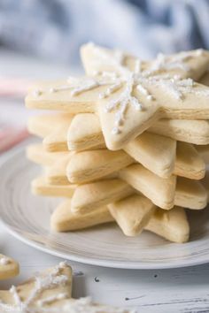 a white plate topped with cut out cookies