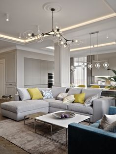 a living room filled with furniture and a chandelier