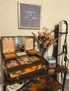 an open suitcase sitting on top of a wooden table