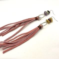 Unleash Your Inner Boho Spirit With These Handcrafted Pink Leather Suede Fringe Earrings, A Perfect Blend Of Earthy Elegance And Playful Charm. Each Earring Features A 4.5-Inch Pink Suede Tassel, Bound By Premium Metal Findings. The Earrings Are Adorned With A Unique Series Of Mixed Agate Gemstones, Each Measuring About Half An Inch, Known For Their Natural Beauty And Variegated Colors. 925 Sterling Silver Earring Hooks, These Earrings Have A Total Drop Length Of 6.5 Inches, Ensuring A Dramatic Teardrop Earrings Gold, Earthy Elegance, Long Statement Earrings, Bar Stud Earrings, Earring Ideas, Crystal Hoop Earrings, Suede Tassel, Chanel Earrings, Stylish Earring