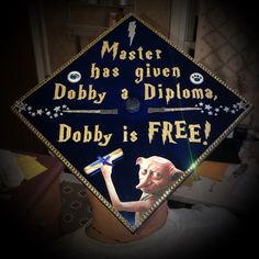 a blue graduation cap with the words master has given dobby a diploma, dobby is free