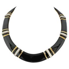 The David Webb 18K Yellow Gold Black Enamel Collar Necklace is a stunning piece of jewelry that showcases the brand's signature style and attention to detail. Crafted in 18K yellow gold, this collar necklace features black enamel, creating a striking contrast and adding a touch of sophistication to the design. The necklace is embellished with gold groove-like accents, which add texture and visual interest to the piece. Round diamonds are also incorporated into the necklace, adding a touch of spa Luxury Elegant Necklace With Black Enamel, Diamond Collar, David Webb, The David, Fantasy Fashion, Collar Necklace, Black Enamel, Signature Style, Gold Black